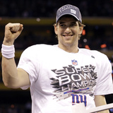 New York Giants and New England Patriots - Super Bowl XLVI - February 5, 2012: Eli Manning Photographic Print by David J. Phillip