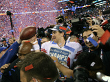 New York Giants and New England Patriots - Super Bowl XLVI - February 5, 2012: Eli Manning Photographic Print by Ben Liebenberg