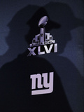 New York Giants and New England Patriots - Super Bowl XLVI - February 5, 2012: Eli Manning's shadow Photographic Print by Eric Gay