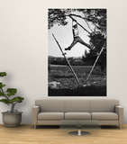 Kenneth Merriman Swinging on Tree Limb After Kicking Away Stilts Prints by Robert W. Kelley