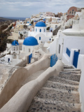 Bell Tower and Blue Domes of Church in Village of Oia, Santorini, Greece Photographie par Darrell Gulin