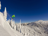 Jumping from Cliff on a Sunny Day at Whitefish Mountain Resort, Montana, Usa Fotografisk tryk af Chuck Haney