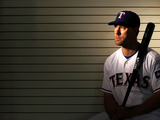 Surprise, AZ - February 28: Texas Rangers Photo Day - Alexi Ogando Photographic Print by Jamie Squire