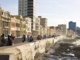 View Along the Malecon, People Sitting on the Seawall Enjoying the Evening Sunshine, Havana, Cuba Photographic Print by Lee Frost