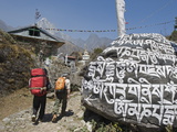 Trekkers Walking Past a Mani Stone, Solu Khumbu Everest Region, Sagarmatha National Park, Nepal Photographic Print by Christian Kober