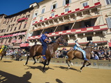 Riders Racing at El Palio Horse Race Festival, Piazza Del Campo, Siena, Tuscany, Italy, Europe Photographic Print by Christian Kober