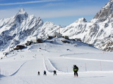 Skiers, Mountain Scenery in Cervinia Ski Resort, Cervinia, Valle D'Aosta, Italian Alps, Italy Photographic Print by Christian Kober