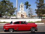 Classic Red American Car Parked By the Old Square in Vinales Village, Pinar Del Rio, Cuba Photographic Print by Lee Frost