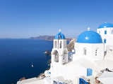 Blue Domed Churches in the Village of Oia, Santorini (Thira), Cyclades Islands, Aegean Sea, Greece Photographic Print by Gavin Hellier