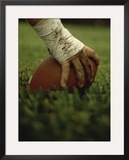 Close-up of the Hand of an American Football Player Holding a Football Framed Photographic Print