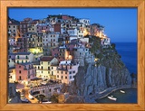 Dusk Falls on a Hillside Town Overlooking the Mediterranean Sea, Manarola, Cinque Terre, Italy Photographie encadrée par Dennis Flaherty