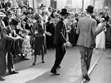 Men dancing in the street as revelers celebrate New Orleans Mardi Gras. February 1938 Premium-Fotodruck von William Vandivert