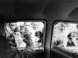 Indian children looking into puppeteer Bil Baird's car, March 1962. Premium Photographic Print by James Burke