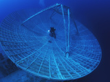 A Radar Dish Atop a Sunken Ship Used to Track Missiles Photographic Print by David Doubilet