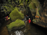 A Guide Leads a Team Through a Passage in Claustral Canyon Photographic Print by Carsten Peter