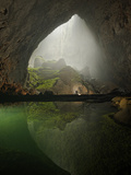 A Rock Formation Shines Beneath a Skylight in Hang Son Doong Photographic Print by Carsten Peter