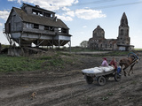 A Horse Cart on a Road Passing An Abandoned Granary and Church Photographic Print by Randy Olson