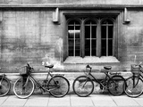 A Row of Bikes Leaning Against an Old School Building in Oxford, England Photographic Print by Keith Barraclough