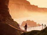 Crossing Carrick-A-Rede Rope Bridge on the North Antrim Coast Photographic Print by Chris Hill
