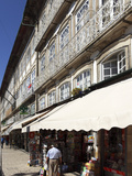 A Newsagents Stand under a Building with a Wrought Iron Balcony on the Largo Do Toural, Guimaraes,  Photographic Print by Stuart Forster