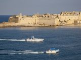 Fort Ricasoli from Valletta, with Yacht and Water Taxi Passing, Malta, Mediterranean, Europe Photographic Print by Nick Servian
