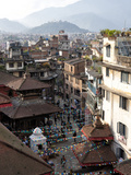 View over Narrow Streets and Rooftops Near Durbar Square Towards the Hilltop Temple of Swayambhunat Photographie par Lee Frost