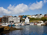 Boats Moored in the Harbour, Next to the Historical Area known as Tinganes, in the City of Torshavn Photographic Print by Kimberley Coole