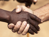 Black and White Male's Handshake, Opuwo, Namibia, Africa Photographic Print by Wendy Kaveney