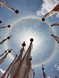 A Very Unusual Full Circle Rainbow Phenomenon Surrounded by Lungdhar Buddhist Prayer Flags Photographic Print by Nigel Pavitt