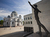 Lithuania, Central Lithuania, Kaunas, St. Michael the Archangel Church and the Sculpture of Man Photographic Print by Walter Bibikow
