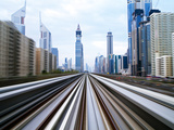 Opened in 2010, the Dubai Metro, Mrt, in Motion Along Sheikh Zayed Road at Dusk, Dubai, United Arab Photographic Print by Gavin Hellier