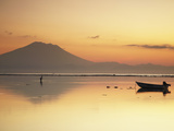 Fisherman Standing in Sea with Mount Agung in the Background, Sanur, Bali, Indonesia Photographic Print by Ian Trower