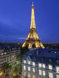 France, Paris, Eiffel Tower, Viewed over Rooftops at Night Photographic Print by Gavin Hellier