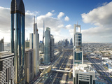 Skyscrapers Along Sheikh Zayed Road Looking Towards the Burj Kalifa, Dubai, United Arab Emirates Photographic Print by Gavin Hellier