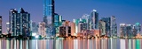 Shimmering Skyline of Miami along Biscayne Bay on Cloudness Night Prints