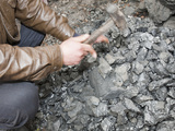 A Man Breaks Up Coal for Domestic Use, China Photographic Print by Ashley Cooper