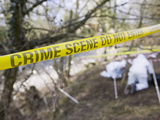 Yellow Crime Scene Tape in Front of a Murder Scene Being Investigated by Police Photographic Print by Ashley Cooper
