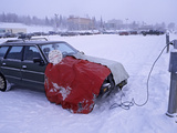 Car Plugged into an Engine Heater to Keep the Vehicle Able to Start Photographic Print by Patrick Endres