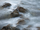 Blurred Motion of Waves Crashing over Rocks Photographic Print by Adam Jones
