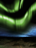 Illustration of the Aurora Borealis over Distant Hills at Night Photographic Print by Victor Habbick