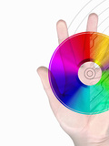 Illustration of a Human Hand with a Computer Disc and Circuit Board Design on a White Background Photographic Print by Victor Habbick
