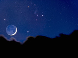 Crescent Moon with Earthshine Above a Cloud Layer with the Constellation Orion Photographic Print by David Nunuk