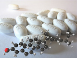 Lipitor -- a Medication Precribed to Treat High Cholesterol with a Molecular Model of Cholesterol Photographic Print by Carol & Mike Werner