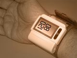 Hand of a Adult Male Wearing a Wrist Cuff for Measuring Blood Pressure Photographic Print by Carol & Miker Werner