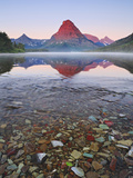 Dawn Light Sets the Peaks Aglow over Misty Two Medicine Lake, Glacier National Park, Montana, USA Photographic Print by Geoffrey Schmid