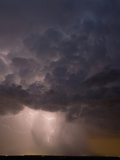 Lightning Illuminates a Small But Intense Thunderstorm Producing Torrential Rain, Hail Photographic Print by Jon Van de Grift