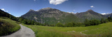 Field with a Mountain Range in the Background, Blenio Valley, Ticino, Switzerland Photographic Print by Panoramic Images 