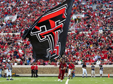 Texas Tech University - Red Raider Cheerleaders and Flag Lámina fotográfica por Michael Strong