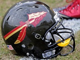Florida State University - New FSU Football Helmet on the Field Photographic Print by Mike Olivella
