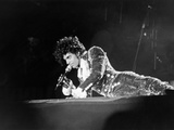 Prince, Lying on Stage During His Purple Rain Tour, 1984 Photographic Print by Michael Cheers
